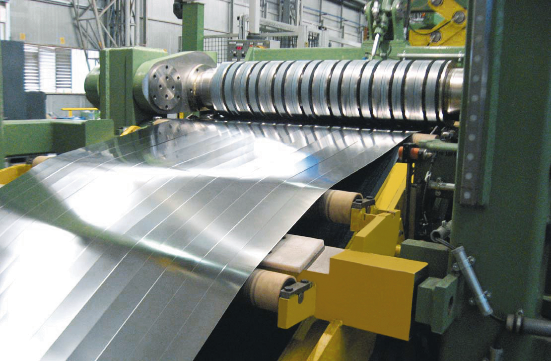 Sheet Metal Strips Exiting The Slitting Line Stock Photo - Download Image  Now - Steel, Curled Up, Cutting - iStock